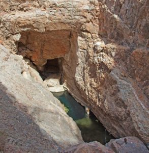 The Devils Hole pupfish lives in an aquifer accessible through this cave entrance — and nowhere else on earth. Courtesy of Jesse Chehak. (Originally published on Wired.)